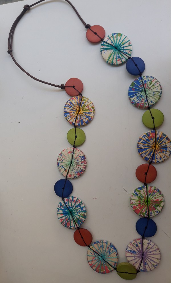 Necklace around colourful design